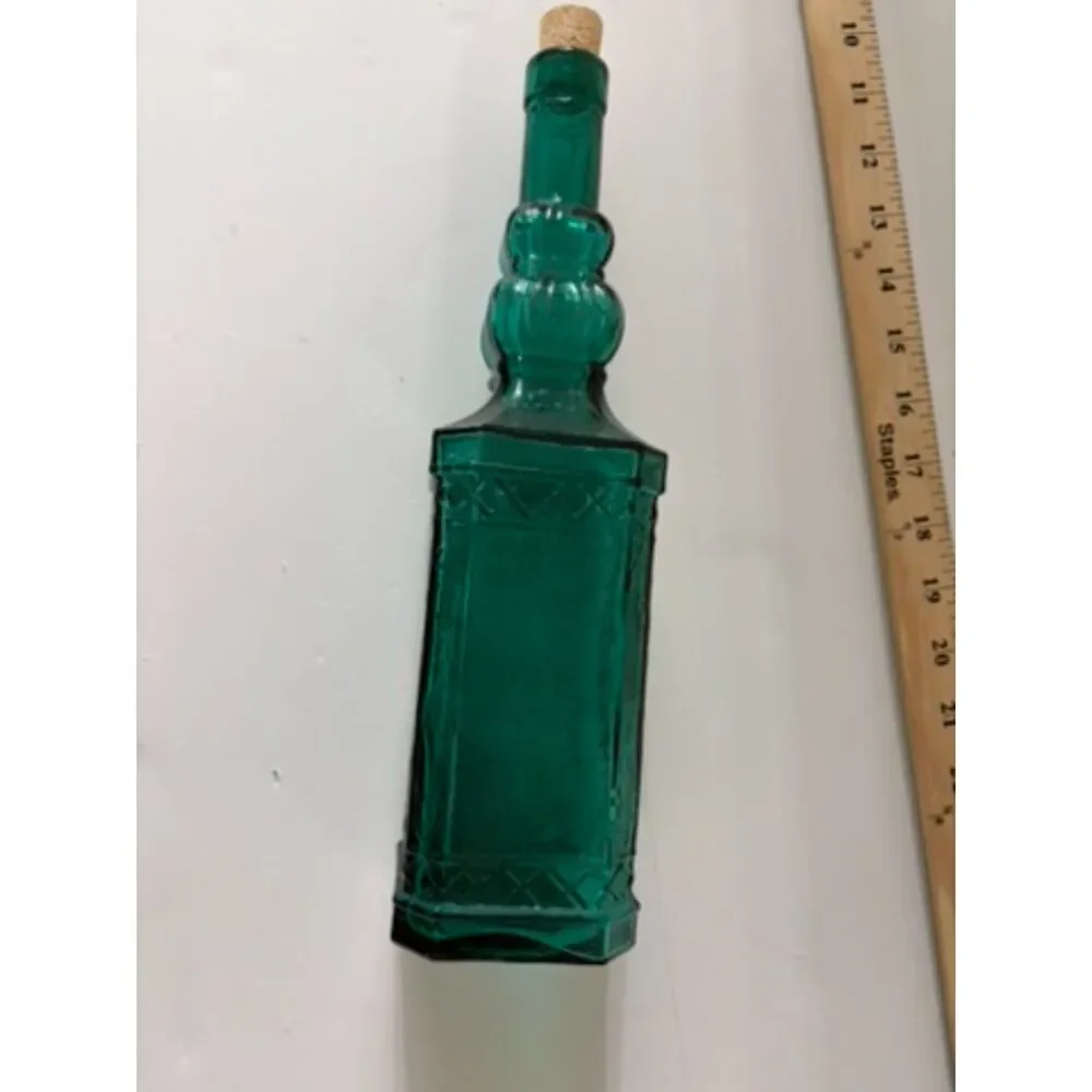 vtg emerald green glass decanter bottle with embossed sides and cork stopper